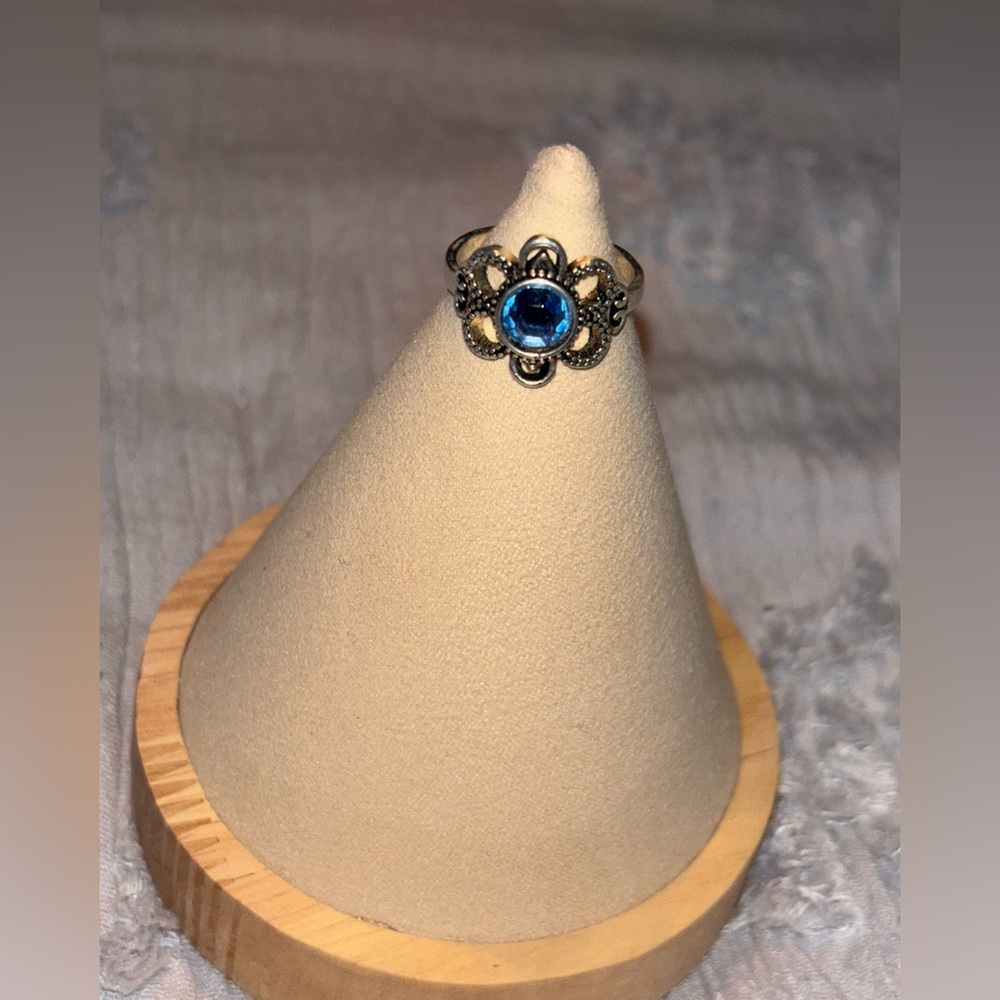 Silver ring with light blue stone 
Size 8